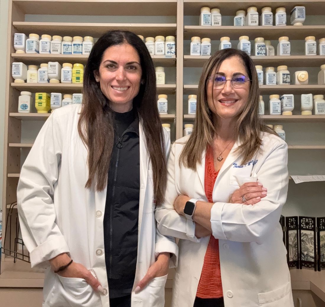 Theresa McIntosh and Jenna Vilardo in white coats - Acupuncture Associates of Plantation